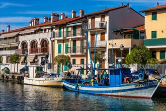 Fishing boats in the harbour, island of the lagoon town of Grado, north coast of the Adriatic Sea,