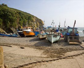 Fishing boats on the beach at the historic and attractive fishing village of Cadgwith Cove on the