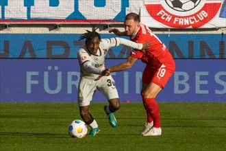 Football match, Jeremine FRIMPONG Bayer Leverkusen left in duel with Jonas FOeHRENBACH 1.FC