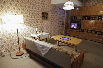 View into a living room of a prefabricated flat in the DDR Museum. The DDR Museum shows the life