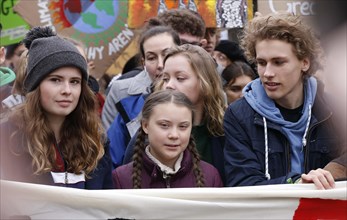 Climate activists Luisa Marie Neubauer (left) and Greta Thunberg demonstrate with thousands of