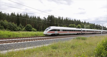 An ICE T train passes through the Tuehringer Forest near Wolfsberg. The new Leipzig Erfurt line is