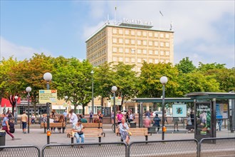 Cityscape view at people waiting at a bus and tram stop in Gothenburg city, Gothenburg, Sweden,
