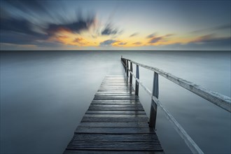 Long exposure of a jetty at the North Sea at high tide, landscape photography, landscape