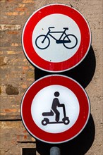 Old town signs against bicycles and e-scooters, Grado Island, north coast of the Adriatic, Friuli,