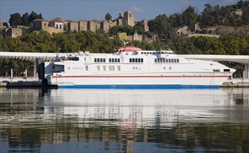 Alcantara Dos catamaran ferry at the quayside in new port development in Malaga, Spain with the