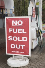 No Fuel Sold Out sign on petrol pumps in John Grose garage, Melton, Suffolk, England, United