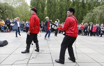 Musicians play Russian folk music on the 74th anniversary of the victory of Russia over Germany, at