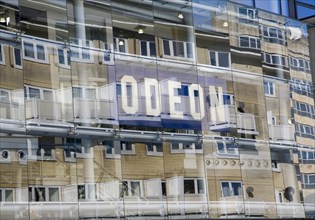 Buildings reflected by glass frontage of the Odeon cinema, Bath, Somerset, England, United Kingdom,
