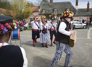 Traditional Morris Men doing country dancing in the village of Shottisham, Suffolk, England, United
