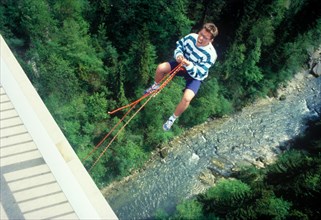 Man jumping from Bridge Echelsbacher Brucke, river Ammer, Murnau, Upper Bavaria, Germany, vintage,