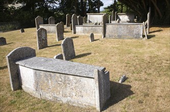 Old historic tombs and gravestones in churchyard at Mistley Towers, Essex, England, United Kingdom,