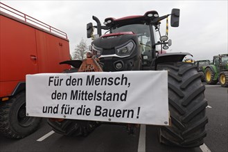 For the middle class, sign on a tractor, farmers' protests, demonstration against policies of the