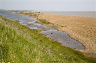 Shingle beach bar and lagoon formed by north to south longshore drift at Bawdsey, Suffolk, England,