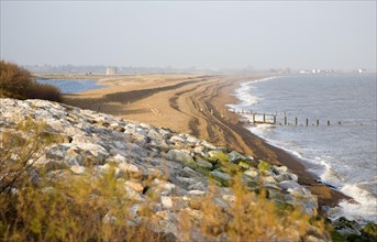 Shingle bay bar and lagoon formed by longshore drift, view north from Bawdsey to Shingle Street,