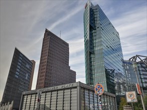 View of Potsdamer Platz with modern skyscrapers and a cloudy sky over the city of Berlin