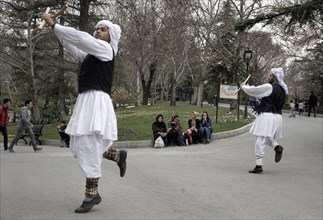 Musicians in traditional dress play music in a park in Tehran, Iran, woman, 14.03.2019, Asia