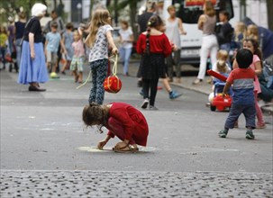 Temporary play street in Berlin Kreuzberg, children playing on a closed street in Berlin, 07.08