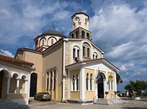 Orthodox church with a prominent bell tower surrounded by cobbled streets, Holy Church of the