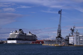 Old or historic harbour, cruise ship of the Celebrity Cruises X shipping line at anchor, warship,