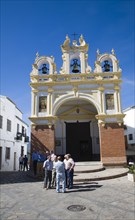Men gather by the baroque church of San Juan at Zahara de la Sierra, Spain Sunday 13 October 2013