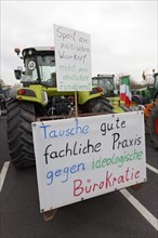 Tractor with sign against ideological bureaucracy, farmers' protests, demonstration against