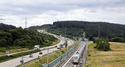 An ICE T on the high-speed line for ICE trains next to the A71 motorway near Behringen. The new