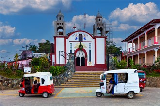Motorbike taxi in front of the Inglesia Ave Maria church, Pluma Hidalgo, Pochutla, Oxaca state,