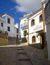 Tourist information building and alleyways in the Andalusian village of Comares, Malaga province,