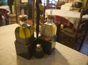 Olive oil condiments on cafe table Spain