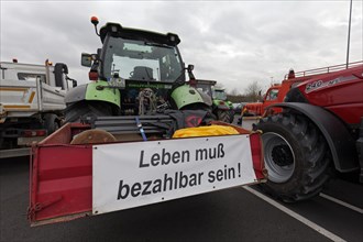 Life must be affordable, banner on a tractor, farmers' protests, demonstration against policies of