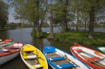 Colourful rowing boats on the Meare at Thorpeness, Suffolk, England, United Kingdom, Europe