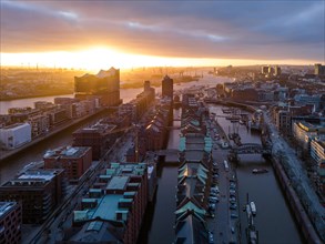 Aerial view of Hamburg harbour at sunset with Speicherstadt warehouse district and Elbe