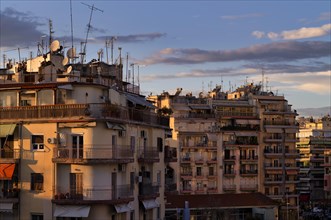 Residential buildings, roof antennas, Leonida Iasonidou street, evening light, Thessaloniki,