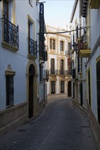 Historic buildings narrow Tenorio street in the old city, Ronda, Spain, Europe
