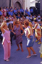 Elderly women dance flamenco at street party in Velez-Malaga, Andalusia, Spain, Southern Europe.