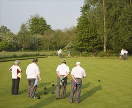 People playing bowls on bowling green at Clare, Suffolk, England, United Kingdom, Europe