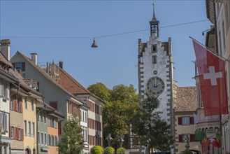 Old town of Dissenhofen on the Rhine, town gate, tower clock with zodiac sign, Swiss flag,