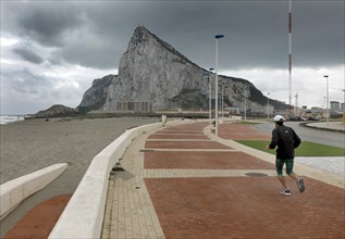 A jogger runs in Spain, near the border with Gibraltar, 14/02/2019
