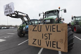 Too much is too much, sign on a tractor, farmers' protests, demonstration against policies of the