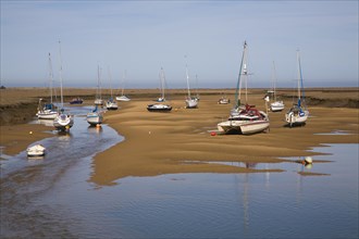 Boats at low tide at Wells next the Sea, Norfolk, England, United Kingdom, Europe