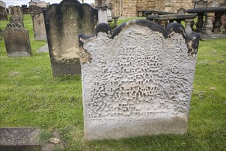 Heavily weathered gravestone at Tynemouth priory, Northumberland, England, United Kingdom, Europe