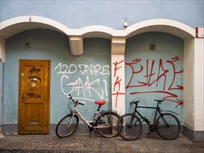 Bicycles leaning against a house wall, graffiti, Graz, Styria, Austria, Europe