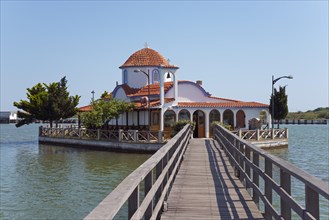Small church on the waterfront connected by a wooden bridge, Monastery of St Nicholas, Monastery of