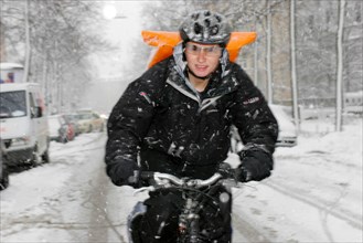 Bicycle courier in winter, Munich, Bavaria, Germany, vintage, retro, Europe