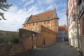 Stone house built in 1510 and historic town fortifications, Buedingen, Wetterau, Hesse, Germany,
