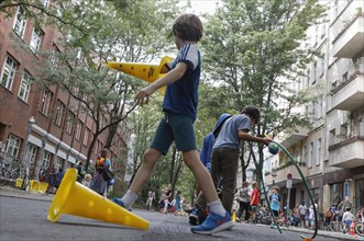 Temporary play street in Berlin Kreuzberg, children playing on a closed street, 07.08.2019