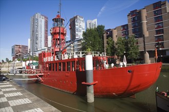 Historic red lightship floating restaurant and modern architecture Wijnhaven, Rotterdam,