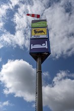 Advertising mast with windsock at a motorway hotel, Thuringia, Germany, Europe