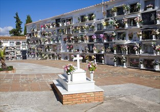 Traditional cemetery decorated with flowers in the Andalucian village of Comares, Malaga province,